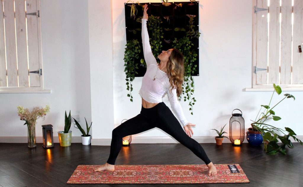 Woman doing yoga in mat
